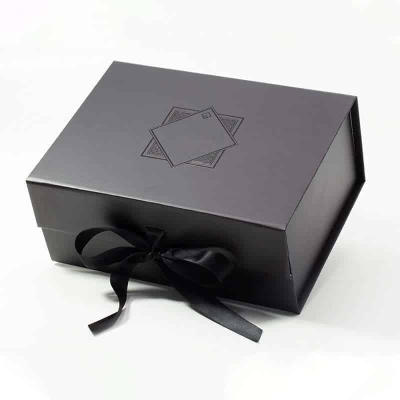 A Black square-shaped box with a Black ribbon, sitting on a white background.